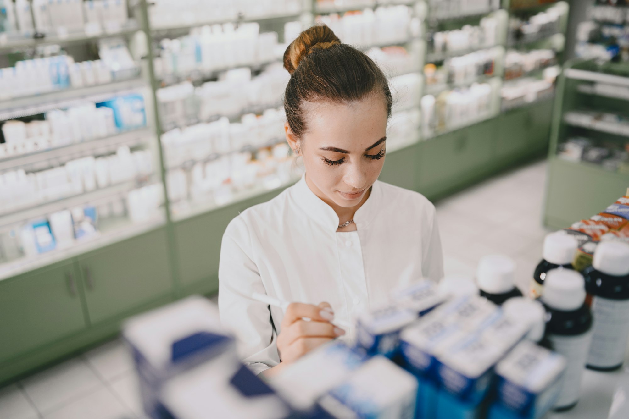 Woman pharmacist checking medicine in pharmacy